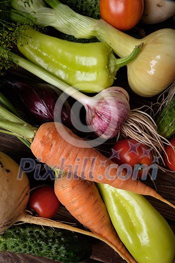 Fresh vegetables on a wooden table. Rustic style. Vegetarianism. Organic food.