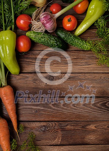 Fresh vegetables on a wooden table. Rustic style. Vegetarianism. Organic food. Space for text.