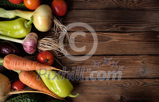 Fresh vegetables on a wooden table. Rustic style. Vegetarianism. Organic food. Space for text.