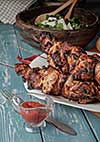 Shashlik with salad on the wooden table