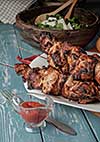 Shashlik with salad on the wooden table