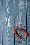 Red Hot Chili Peppers over blue wooden background