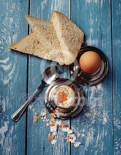 Boiled eggс for breakfast on wooden table. Top view. Toned like instagram.