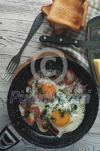 Fried egg for breakfast in the countryside. Low contrast. Instagram style. Fried egg for breakfast in the countryside. Low contrast. Instagram style.