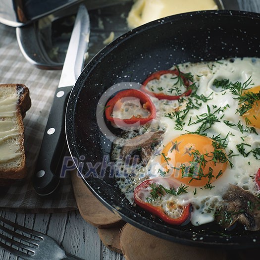 Fried egg for breakfast in the countryside. Low contrast. Instagram style. Fried egg for breakfast in the countryside. Low contrast. Instagram style.