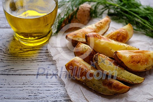 Oven-baked potatoes on a wooden table in rustic style