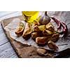 Oven-baked potatoes on a wooden table in rustic style