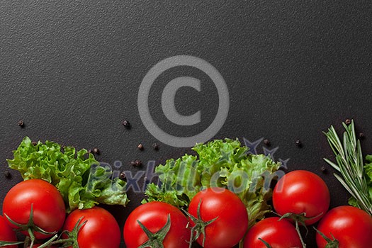 red tomatoes with green salad on black red tomatoes with green salad on black