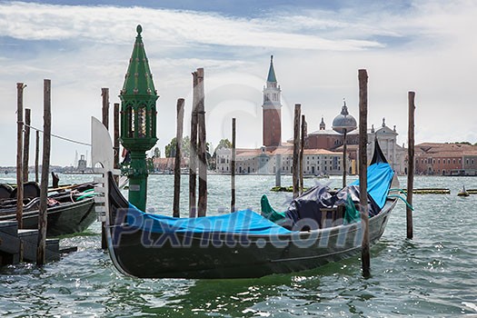 Gondolas and San Giorgio Maggiore church on Grand Canal in Venice Gondolas and San Giorgio Maggiore church on Grand Canal in Venice