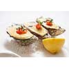oysters with sauce and lemon on plate