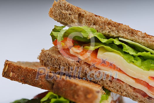 fresh sandwich close up with vegetables and meat fish isolated on white background fresh sandwich close up with vegetables and meat fish isolated on white background