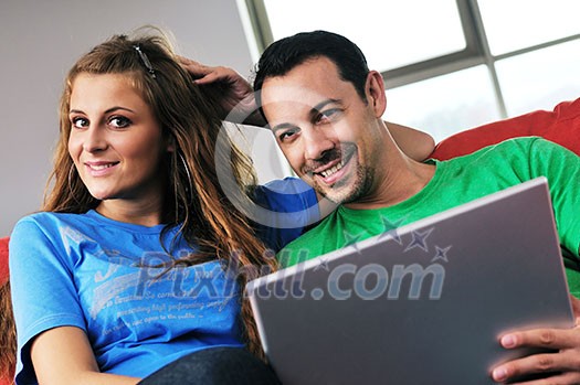 happy young couple have fun and relax at comfort bright apartment and work on laptop computerhappy young couple have fun and relax at comfort bright appartment and work on laptop computer happy young couple have fun and relax at comfort bright apartment and work on laptop computerhappy young couple have fun and relax at comfort bright appartment and work on laptop computer