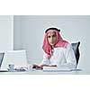 happy young arabic business man working at bright office