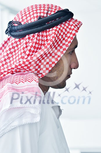 happy young arabic business man working at bright office