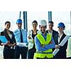 business people group on meeting and presentation  in bright modern office with construction engineer architect and worker looking building model and blueprint planbleprint plans