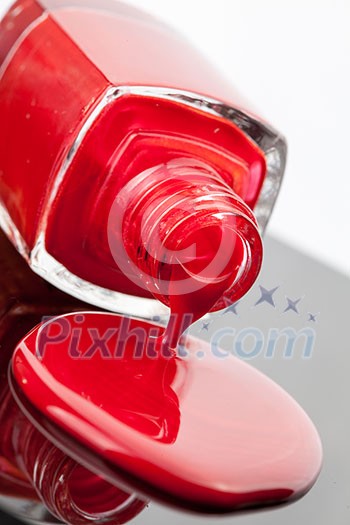 red nail polish bottle