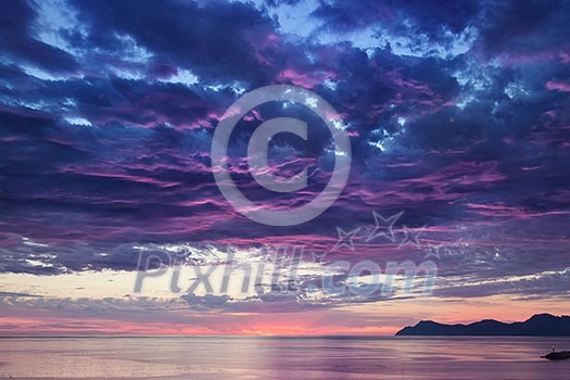 landscape with sea and mountains on sunrise