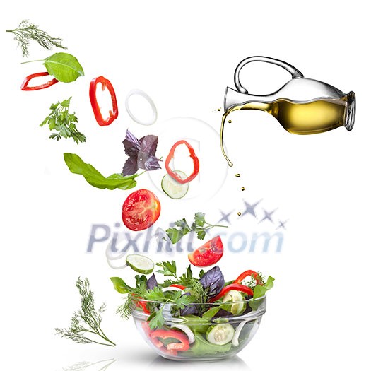 Falling vegetables for salad and oil isolated on white Falling vegetables for salad and oil isolated on white