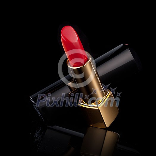 red lipstick isolated on black