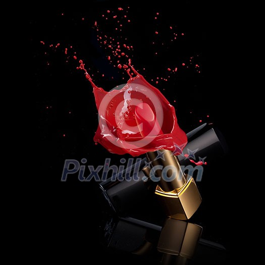 red lipstick with splash of paint isolated on black