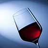 red wine in glass on blue