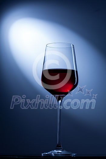 red wine in glass on blue red wine in glass on blue