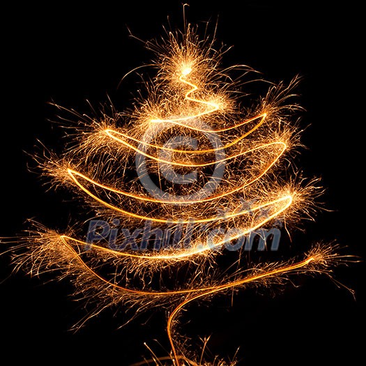 Fir tree of burning christmas sparkler on black background. Bengal fire