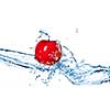 Red apple and water splash isolated on white