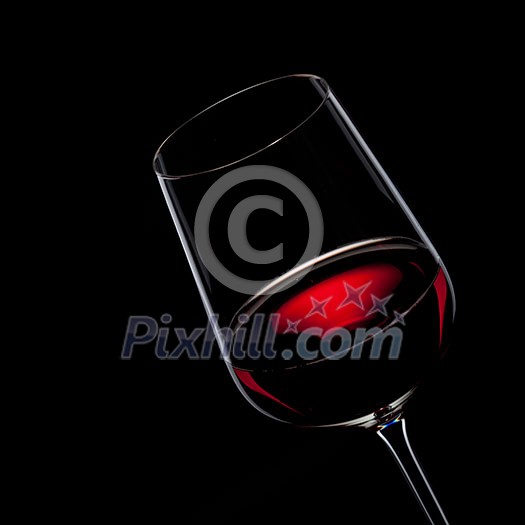 red wine in glass isolated on black