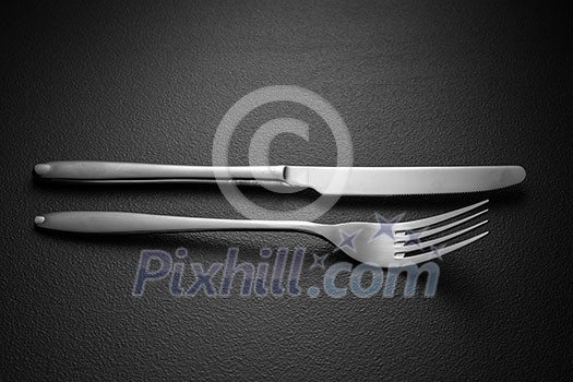 knife and fork on black knife and fork on black
