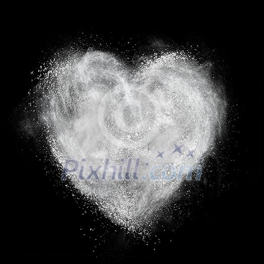 heart made of white powder explosion isolated on black background