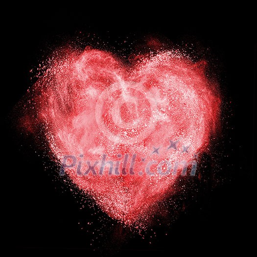 heart made of white powder explosion isolated on black background