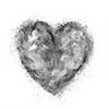 heart made of black powder explosion isolated on white background