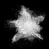 White powder explosion isolated on black background