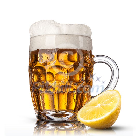 Beer in glass with lemon isolated on white background Beer in glass with lemon isolated on white background