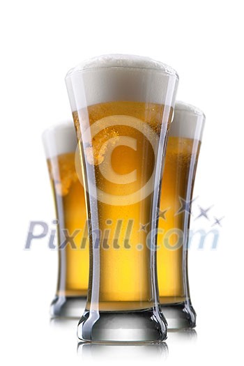 Beer in glass isolated on white background Beer in glass isolated on white background