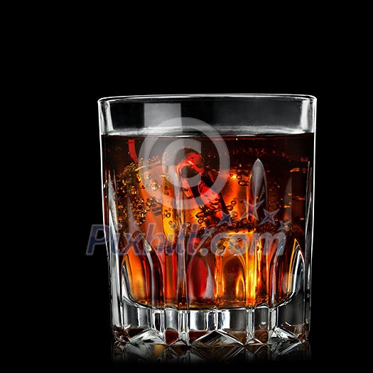 cola with cognac in glass on black cola with cognac in glass on black