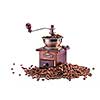 Retro manual coffee mill on roasted coffee beans isolated