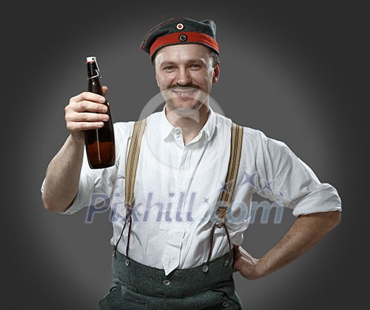 Cheerful man with a beer bottle. Concept - oktoberfest. Cheerful man with a beer bottle. Concept - oktoberfest.
