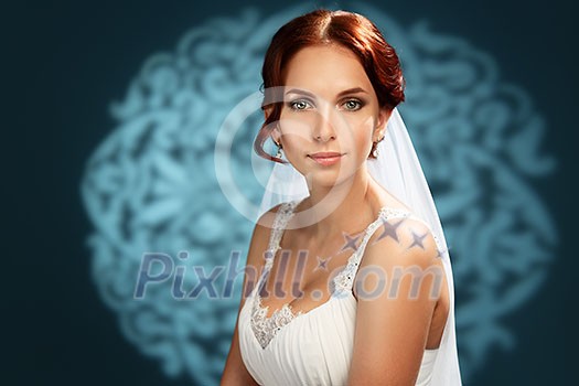 Beautiful red-haired bride on a blue background Beautiful red-haired bride on a blue background