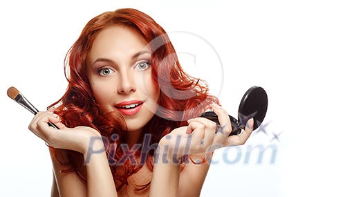 Makeup. Cosmetic. Beauty portrait of pretty ginger woman with brush for makeup and powder. Applying Make-up.