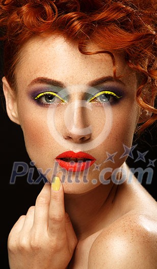 Red-haired. Beautiful girl with bright makeup. Ginger with freckles. 