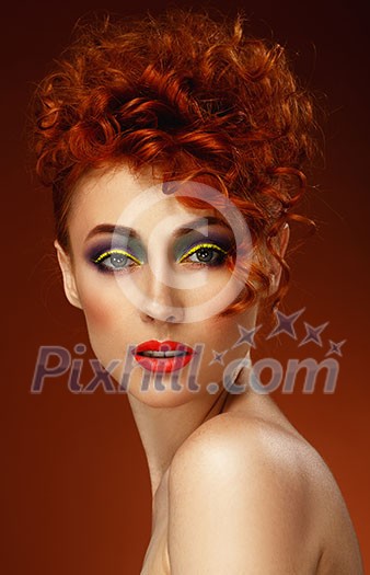 Red-haired. Beautiful girl with bright makeup. Ginger. Hairstyle. 