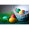 Easter eggs in the basket. Dark background.