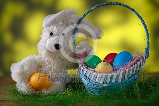 Toy rabbit with Easter eggs.