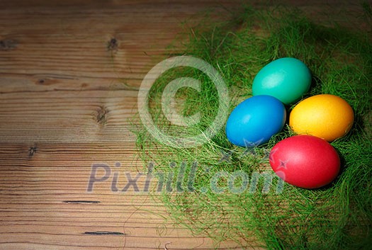 Easter eggs on wooden background.