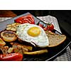 Fried eggs on bread. Plate of grilled vegetables