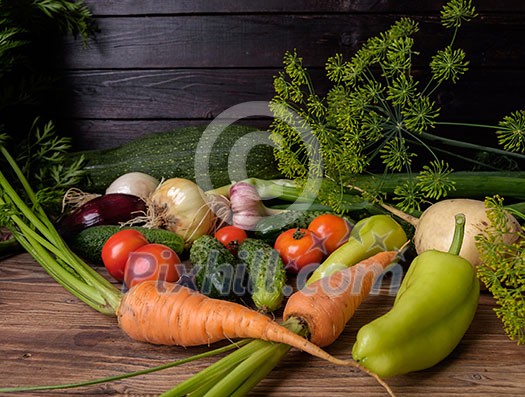 Fresh vegetables on a wooden table. Rustic style. Vegetarianism. Organic food. 