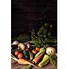 Fresh vegetables on a wooden table. Rustic style. Vegetarianism. Organic food. Space for text.