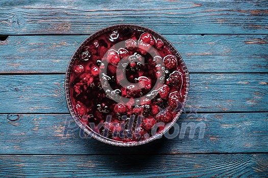 Berry pie on a wooden table.
